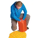 sea_to_summit_air_stream_pump_in_use.webp